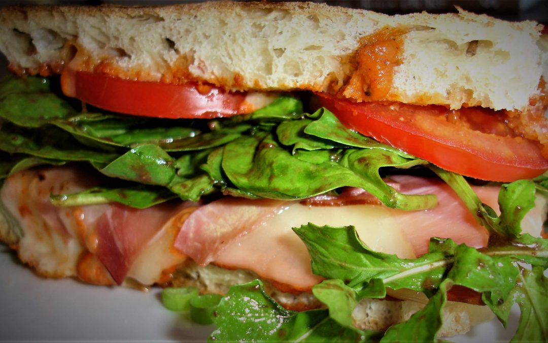 Panini with Prosciutto, Tomato, Romesco Sauce and an Arugula Salad