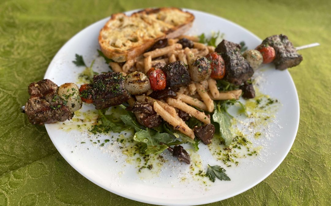 Warm Pasta Salad with Red Wine Braised Mushrooms, Arugula, and Parmesan Cheese